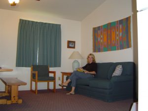 Cottage living room with beautiful lady seated