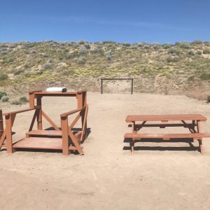 Pistol range with yellow wildflowers